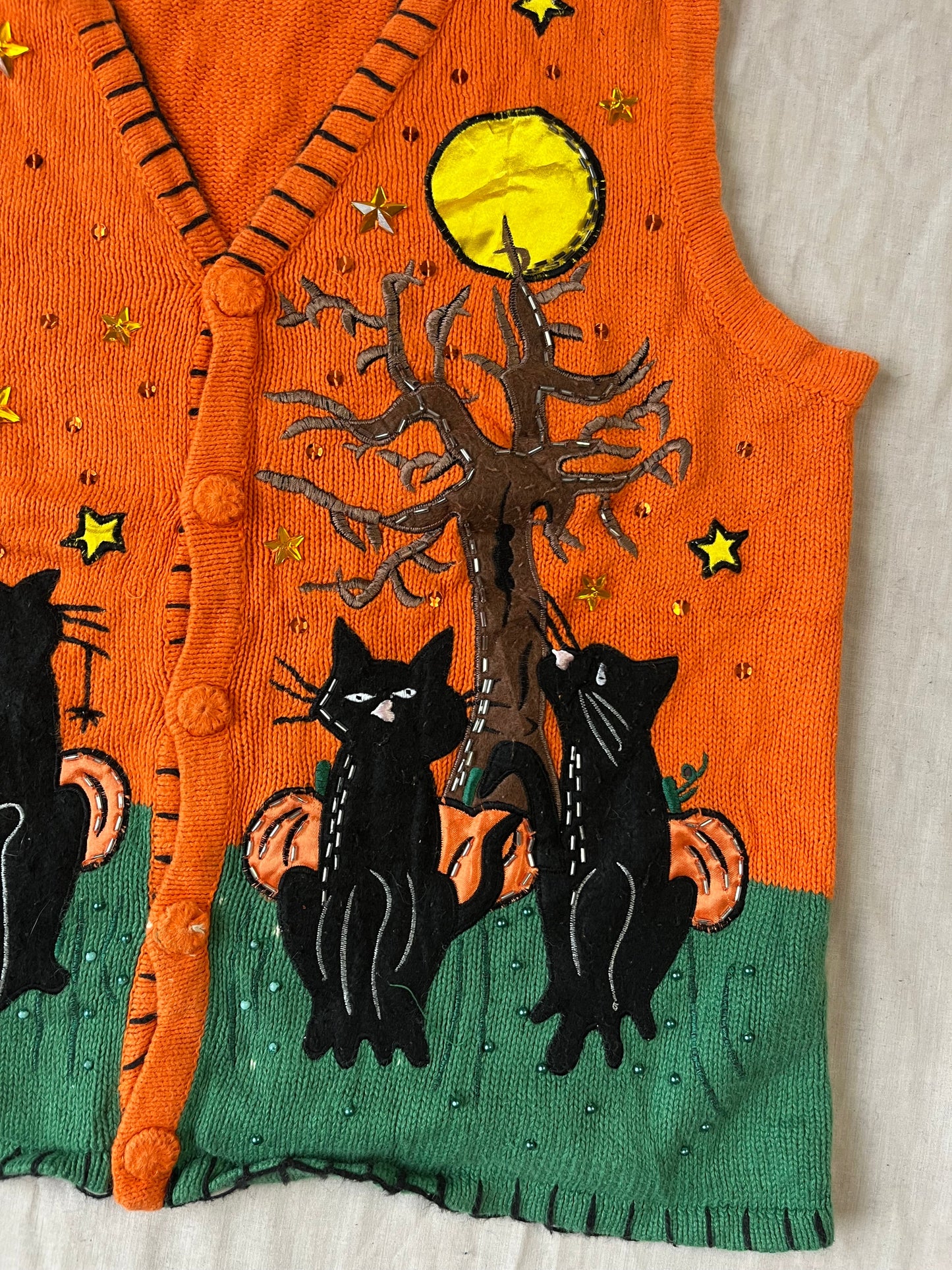The Familiar 1990s Halloween Sweater Vest L